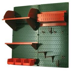 the pegboard is green with red shelves on it