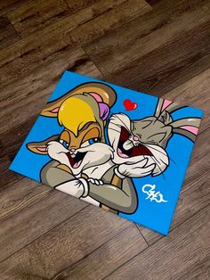 an image of two cartoon characters on a wood floor