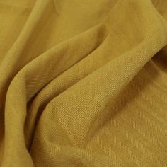 a close up view of a yellow fabric