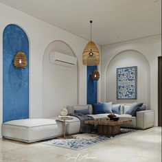 a living room with blue and white walls, couches and tables in the middle