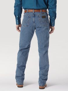 Wrangler Cowboy Cut Performance Stonewash Regular Fit 70% Cotton/29% Polyester/1% spandex, 14 oz. Denim Rise: Mid Front Rise: 10 1/4" Leg: Tapered Leg Opening: 16 3/4" Front Closure: Zip-Fly with button closure Fitted Denim Jeans For Rodeo, Fitted Western Denim Jeans, Classic Fitted Washed Bottoms, Western Style Light Wash Denim Jeans, Western Style Medium Wash Cotton Jeans, Western Style Cotton Jeans In Medium Wash, Light Wash Denim Jeans For Rodeo, Fitted Blue Jeans For Rodeo, Western Style Fitted Full-length Jeans