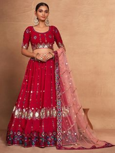 Indulge in the timeless elegance of a rani pink georgette lehenga, adorned with intricate sequin and embroidery work that radiates sophistication and charm. This lehenga, with its semi-stitched design accommodating sizes up to 42 inches, promises a perfect fit for every body type. The 3.5-meter flair adds a touch of grandeur, making every twirl and movement a mesmerizing sight. Complementing the lehenga is an un-stitched choli material, providing the flexibility to tailor it precisely to your pr Red Georgette Lehenga, Faux Mirror, Engagement Gown, Lehenga Crop Top, Georgette Lehenga, Lehenga Choli Wedding, Rani Pink, Floral Lehenga, Party Wear Lehenga Choli