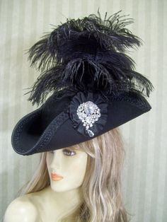 "Beautiful black one of a kind woolen blend pirate/tricorn hat with black braided trim, black flared ostrich feathers, black cocarde with jewel accent.. This hat is about 22 1/2\" for the inside circumference. If this is to big for you then let me know and I can include a hat sizer in your package. I ship Priority mail. I ship many times a week. If you need your item quicker let me know your zip code and I can figure shipping rates for you. Please let me know if you have any questions I accept P Tricorn Hat, Black Pirate, Pirate Hat, Steampunk Hat, Bridal Hat, Pirate Hats, Halloween Hats, Fancy Hats, Jack Sparrow