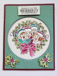 a christmas card with an image of three people on it and holly wreaths around the edges