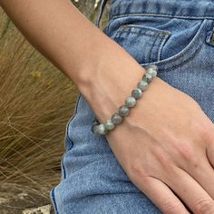 Natural Gray Labradorite Bracelet|

Labradorite is a beautiful gemstone that exudes self-awareness and aids in the healing of your soul. Our beaded labradorite bracelets weave together calming gray colors to capture this mystical stone. Soft, soothing gray tones add just enough edge to add a little flair into an outfit while reminding you not to take things too seriously. Wear it solo or layer it for a cool and hip style. Silver Labradorite Bracelet With Gemstone Beads, Adjustable Labradorite Spiritual Crystal Bracelet, Spiritual Labradorite Bracelet, Hand-strung Labradorite Beaded Bracelets As Gift, Gold Labradorite Beaded Bracelet, Spiritual Style, Hip Style, Labradorite Bracelet, Grey Tones, Healing Jewelry