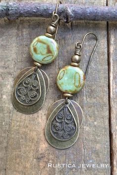 Boho brass and earthy green Czech glass dangle earrings. Artisan Green Brass Earrings, Vintage Green Brass Earrings, Bohemian Earrings With Antique Finish For Jewelry Making, Earthy Brass Dangle Earrings, Green Brass Earrings Nature-inspired, Nickel-free Brass Earthy Earrings, Earthy Nickel-free Brass Earrings, Earthy Bronze Earrings With Ear Wire, Earthy Green Dangle Earrings