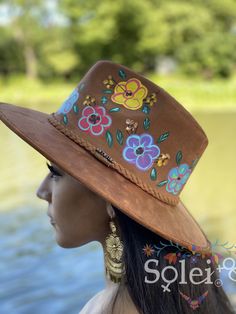 This Mexican Suede Hat has beautiful hand painted flowers, perfect to add that special touch to any outfit. This Mexican Hat is completely unique and one of a kind! Bohemian Wide Brim Hat Bands Hand Painted, Bohemian Multicolor Hat Bands For Spring, Artistic Fedora For Spring Festival, Bohemian Adjustable Sun Hat With Flower Shape, Adjustable Bohemian Sun Hat With Flower Shape, Spring Festival Sun Hat Hand Painted, Bohemian Adjustable Flower Sun Hat, Adjustable Bohemian Flower Sun Hat, Spring Festival Hand Painted Sun Hat