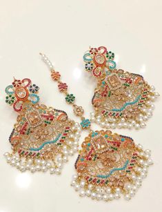 Beautiful nauratan multi stone earrings and Tikka set.