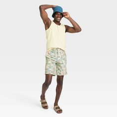 Transition between land and sea in charming tropical style with these Floral Print Hybrid Swim Shorts from Goodfellow & Co™. These hybrid swim shorts made from 4-way stretch, wrinkle-resistant fabric offer comfortable wear in or out of water. A fly button and zipper along with belt loops offer a secure fit, while the side and back pockets come in handy for stashing small essentials. Plus, the UPF 50+ rated material helps keep you protected from the sun. Pair them with your regular tees and sneak All In Motion, Shipt Shopper, Tropical Style, Upf 50, Above Knee, Swimwear Fashion, Online Purchase, Swim Shorts, Dark Green