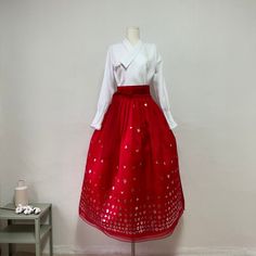 This is a Korean Modern Hanbok wrap style skirt for Women. This skirt is made of three layers, so it is beautiful without having to wear an underskirt with a natural voluminous feel. This hanbok is modernly designed so you can wear it comfortably and beautifully. This modern hanbok is perfect dress for daily and celebrations such as parties or various events. ⭐This skirt can be made in custom sizes. Please contact me if you would like to make your size. ⭐Please check out the link below for the w Red Skirted Party Dress, Festive Tiered Skirt For Spring, Festive Spring Tiered Skirt, Red Festive Skirt For Spring, Festive Red Skirt For Christmas, Spring Festive Tiered Skirt, Red Christmas Skirt For Festive Occasions, Elegant Red Skirt For Festive Occasions, Red Long Pleated Skirt Dresses