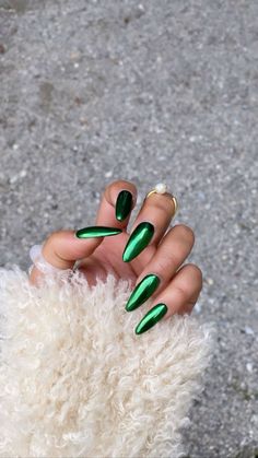 Discover the enchantment of the season with our Pinterest board featuring 'Emerald Elegance: Green Chrome Nails for Christmas.' Immerse yourself in the allure of festive greens that capture the holiday spirit. From chic designs to radiant chrome finishes, explore the magic of these nails that bring a touch of Christmas glamour to your fingertips. Pin your favorites and let your nails shine brightly this holiday season!#green#nails#nailideas#greennails#christmasnails#almondnails#chrome#nails#chromenails Chrome Green Nails Christmas, Metalic Green Nail, Red Green Chrome Nails, Green Christmas Chrome Nails, Dark Green Crome Nails, Dark Green Chrome Nails Designs, Crome Green Nails, Holiday Chrome Nails Designs