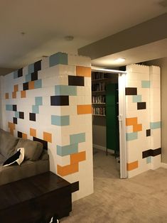 a living room filled with furniture next to a book shelf