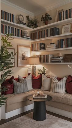 a living room filled with lots of furniture and bookshelves on top of it