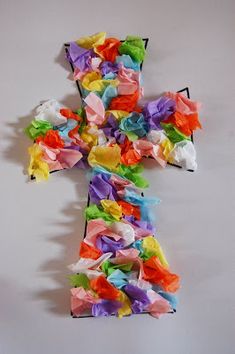 a cross made out of colored tissue paper