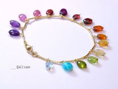 Amazing vibrant colors in this unique gemstone bracelet! The oval gemstones dangle and dance on your wrist creating a never-ending play of color and glow! This bracelet is full of movement and creates an attractive boho chic modern look. You can wear it separately or layer with any other bracelet in your collection. ⭐ DETAILS: [...] Elegant Rainbow Bracelets For Gift, Elegant Rainbow Bracelets For Gifts, Multicolor Gemstone Beads, Bohemian Multicolor Gemstone Bracelets, Handmade Multicolor Gemstone Bracelet, Elegant Colorful Bracelets For Gifts, Multicolor Gemstone Bracelets As Gift, Multicolor Gemstone Accents Bracelets As Gift, Multicolor Gemstone Accents Bracelet Gift