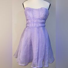 Altar'd State Dress Size Xl Lavender Purple Sparkle Organza Mini Dress Featuring A Strapless Cut, Layered Design, Sweetheart Neckline, Silicone Lining To Help Hold In Place Fit: Fit & Flare Closure: Zipper Materials: 100% Polyester, Lining; 100% Polyester Strapless Tags: Spring, Summer, Country, Western, Boho, Festival, Concert, Anthro, Anthropologie, Dark, Solid, Feminine, Nwt, Never Worn, Brand New, Y2k, 90’s, Floral, Resort, Cruise, Vacation, Lace, Midi Skirt, Bohemian, Flirty, Maxi Skirt, Co Purple Fitted Strapless Dress For Spring, Purple Strapless Dress With Sweetheart Neckline, Spring Purple Mini Dress With Fitted Bodice, Purple Strapless Cocktail Dress, Lavender Prom Dress For Summer, Lavender Summer Prom Dress, Strapless Purple Spring Dress, Lavender Mini-length Dress For Prom, Lavender Mini Length Dress For Prom