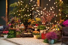 a room filled with lots of flowers and lights