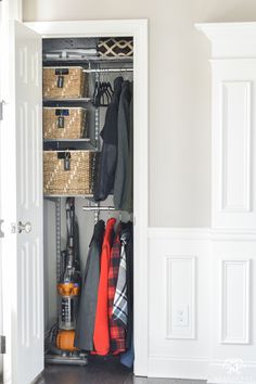 an open closet with clothes and other items