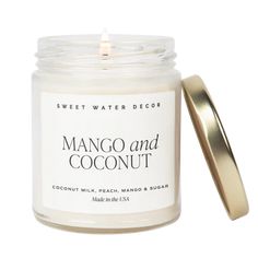 If you like Piña Coladas and getting caught in the rain you'll love our Mango and Coconut candle! Sweet fruit notes topped off with creamy coconut milk will have you on island time in no time!SCENT NOTES: Top: Pineapple, Mango Middle: Orange, Peach Base: Coconut Milk, Sugar CANDLE INFO: Size: Volume 9oz | 208g Net Weight | 2.75 x 2.75 x 3.5" Burn Time: 40+ Hours Wick: 100% Cotton (Lead and Zinc Free) Wax: Proprietary Soy Based Wax Blend | Vegan, Non-GMO, Kosher | Made in USA Premium Fragrance Oi Orange Scented Candle, Water Decor, Candle Quotes, Coconut Candle, Sweet Water, Summer Candles, Clear Jars, Mango Coconut, Tropical Fruits