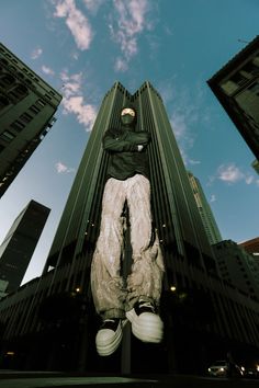 a person standing in front of a tall building