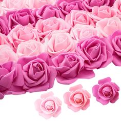 pink roses are arranged in rows on a white background with smaller ones to the side