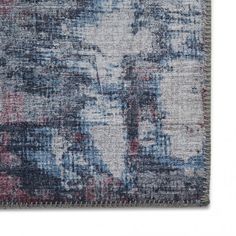 a blue and red area rug with an abstract design on the bottom, in front of a white background