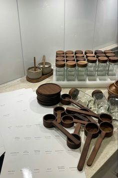 wooden utensils are sitting on a counter top