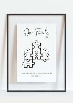 a black and white puzzle piece with the words our family on it