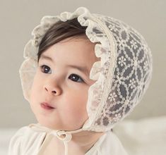 Product Details: The color is ivory not true white. Two sizes now!! Small fits newborn to 5m Medium fits 6-15m Soft nylon/cotton material. Hair accessories are not meant to be used as toys and should always be used under the adult supervision. Adjustable Lace Wedding Bonnet, Cute White Baptism Hat, Adjustable Cream Bonnet As Gift, Adjustable Cream Bonnet As A Gift, White Adjustable Lace Bonnet, White Lace Adjustable Bonnet, Adjustable Cream Bonnet For Baptism, White Adjustable Hat For Baptism, White Adjustable Bonnet For Wedding