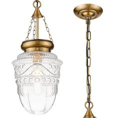 an antique style light fixture with chain hanging from it's side and glass jar on the other side