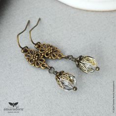 Edwardian inspired, vintage style earrings featuring ornate bronze finish floral connectors combined with crystal clear Czech glass beads and brass filigree bead caps. Attached to bronze plated copper ear wires for pierced ears.  Each earring is approx 4.2cm (1.7") long from the top of the ear wire. Coordinating items available here: https://www.etsy.com/shop/Amaradorn?ref=seller-platform-mcnav&search_query=eternal+grace Ready to ship - All items are carefully wrapped in tissue paper and then pl Bronze Brass Earrings For Vintage Collection, Bronze Antique Finish Dangle Earrings, Vintage Bronze Chandelier Dangle Earrings, Vintage Bronze Brass Earrings, Ornate Bronze Drop Earrings, Vintage Bronze Filigree Earrings, Vintage Brass Filigree Chandelier Earrings, Floral Filigree, Brass Filigree