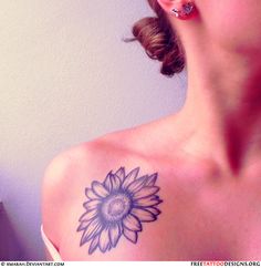 a woman with a sunflower tattoo on her shoulder