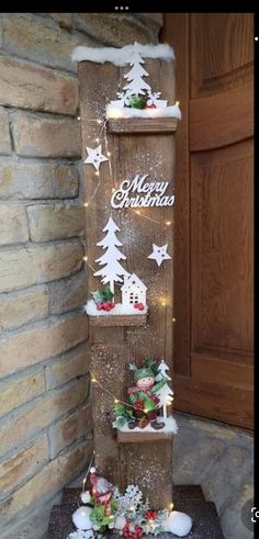 a wooden christmas tree with lights and decorations