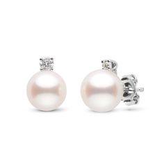 This beautiful set of earrings is comprised of two of our finest, 6.5-7.0 mm,¬†Freshadama quality,¬†white freshwater¬†pearls. These pearls are round, with¬†the highest luster and a smooth surface. The pearls are accented with brilliant round-cut, VS1 G-H quality diamonds totaling 0.06 cttw set in solid 14-karat gold.¬† Timeless White Pearl Earrings With Brilliant Cut, Timeless Brilliant Cut Round Pearl Earrings, Timeless Round Pearl Earrings With Brilliant Cut, Timeless White Brilliant Cut Pearl Earrings, Timeless Round Brilliant Cut Pearl Earrings, Timeless White Gold Pearl Earrings With Brilliant Cut, Timeless Brilliant Cut White Gold Pearl Earrings, Classic Round Akoya Pearl Earrings, Classic White Gold Diamond Earrings With Akoya Pearls