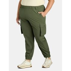 Go casual with Feathers Cargo Pocket Joggers. These pull-on joggers are laid-back and relaxed, offering an elasticized waist and ankles for easy movement. Slash pockets at the hips and cargo pockets on the tapered legs give you plenty of places to stash your everyday items like keys or a phone. Mix in your favorite cami or tee with a hoodie or flannel for a comfy on-trend look. Size: 3X.  Color: Green.  Gender: female.  Age Group: adult. Olive Clothing, Women Jogger Pants, Plus Size Pajamas, Solid Color Pants, Drawstring Jogger, Cargo Pocket, Plus Size Shorts, Joggers Womens, Loungewear Set