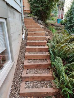 a set of wooden steps leading up to a house