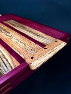 a wooden cutting board sitting on top of a table