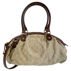 Color: Beige with brown leather Material: canvas with leather finishes Style No.: 223974 Measures: H 10” x L 18” x D 7” Drop: 8” (top handle)& 16” (shoulder strap) Comes with: shoulder strap Condition: Good. Discoloration marks to the bottom, marks and light stains throughout. Made in Italy Gucci Brown Coated Canvas Shoulder Bag, Brown Gucci Coated Canvas Shoulder Bag, Gucci Canvas Bags With Gold-tone Hardware, Gucci Top Handle Shoulder Bag With Leather Handles, Gucci Shoulder Bag With Leather Trim And Double Handle, Gucci Shoulder Bag With Double Handle And Leather Trim, Gucci Shoulder Bag With Leather Handles And Coated Canvas, Gucci Brown Shoulder Bag With Leather Trim, Gucci Top Handle Shoulder Bag With Leather Trim