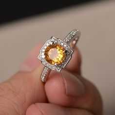 This is a gorgeous handmade creation. Its beauty is its simplicity & Elegance. The 7*7mm round cut natural citrine is crafted in solid sterling silver and with rhodium plated. It is available to customized, if you have any mind, just let me know, we will discuss with it. All item is sent in a beautiful gift box You can realize more lovely stuff clicking the link https://www.etsy.com/shop/knightjewelry?refshopsection_shophome_leftnav Please leave the correct address and you PHONE NUMBER for d Yellow Citrine Ring, Gemstone Ring Silver, Cushion Cut Ring, Cushion Ring, Yellow Citrine, Citrine Ring, Natural Citrine, November Birthstone, Proposal Ring