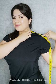 a woman with a measuring tape around her waist