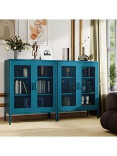 a blue cabinet with glass doors in a living room