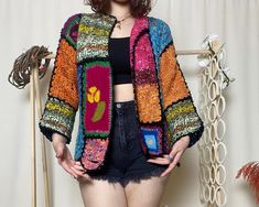 Hey there, beautiful soul! Embrace boho chic with our Handmade Boho Granny Square Crochet Cardigan! This multicolor patchwork floral jacket blends vibrant hues in a short hippie style. Lovingly crafted by artisans, it's the perfect cozy yet trendy knitwear addition to any wardrobe. Elevate your look with unique, handmade charm! ATTENTION Size: Small / Medium / Large Competible Welcome to our exclusive sample product discount! Presenting a unique and exquisite item crafted with love and meticulou Spring Vintage Patchwork Cardigan, Vintage Patchwork Sweater For Spring, Spring Vintage Patchwork Sweater, Bohemian Multicolor Summer Sweater, Bohemian Long Sleeve Patchwork Sweater, Bohemian Patchwork Cardigan For Summer, Spring Festival Crochet Sweater, Handmade Vintage Cardigan For Spring, Vintage Handmade Cardigan For Spring