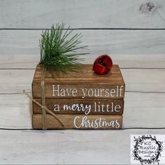 a wooden box with a pine tree on top and the words have yourself a merry little christmas