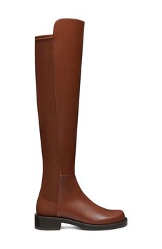 A stretchy back panel and over-the-knee silhouette amplify the modern appeal of a sleek leather boot balanced by a plain toe and stacked block heel. 1" heel (size 8.5) 22" shaft; 13 1/2" calf circumference. Narrow calf Leather and synthetic upper and lining/synthetic sole Made in Spain Stuart Weitzman 5050, Knee Boot, Leather Boot, Over The Knee Boots, Over The Knee, Stuart Weitzman, The Knee, Calf Leather, Leather Boots