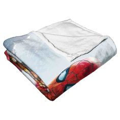 the spiderman blanket is folded up and ready to be used