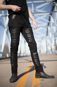 Men's stretch twill pants with cruelty free serpentine leather chevrons down the front. Chunky black zipper pockets, grommet detail, and zipper tape seams on the knees. These jeans are perfect for any goth industrial, rivethead, warcore, music festival, dark, post-apocalyptic, dystopian, cyberpunk, moto, biker, deserted wasteland, playa, military inspired, or punk wardrobe. Sizing runs like normal men's jeans, waist size measures +2". For example, size 32 measures 34". This is standard men's pant sizing.  Pictured with the Sepulchre cowl hood tank. Click here to purchase:  https://www.etsy.com/listing/290038797/sepulchre-shirt-mens-black-hood-cowl-top This item is in STOCK. It ships in 1-3 business days. Fitted Leather Gothic Pants, Gothic Black Leather Pants, Black Gothic Leather Pants, Fitted Gothic Leather Pants For Streetwear, Gothic Leather Bottoms For Alternative Fashion, Fitted Black Jeans For Biker Events, Fitted Punk Leather Bottoms, Fitted Leather Punk Bottoms, Punk Style Fitted Leather Bottoms