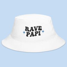 Introducing our "Rave Papi" Bucket Hat – a stylish addition to your rave and festival wardrobe. This hat is perfect for those who love to immerse themselves in the colorful and high-energy atmosphere of music festivals and raves. Embrace the festival vibes with this eye-catching bucket hat. The "Rave Papi" design signifies your passion for the rave culture and the EDM scene, making it an ideal choice for expressing your love for electronic music and the electrifying festival experience. Whether Music Hat, Festival Games, Festival Mode, Rave Culture, Bucket Hat White, Festival Gear, Edm Festival, Festival Accessories, Festival Style