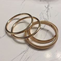 Gold Color Fashion Bracelets. 2 Are Solid And 2 Are Flexible-Not Stretchy. They Are 2.75in In Diameter. Trendy Gold Bangle For Spring, Spring Gold Trendy Bangle, Everyday Gold Bracelets For Spring, Blink 182 Bracelet, Vintage Chanel Handbags, Adjustable Bangle Bracelet, Adjustable Bangle, Gold Bangle Bracelet, Gold Bangle