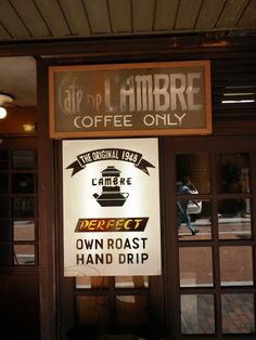 there is a sign on the door of a coffee shop that says, cafe de limbbre coffee only