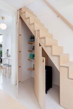 an open staircase leading up to a living room